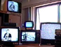 Camcorder pointed at my 5 monitors (the middle one is hooked up to the converter box, the two on the left are stations that switched to "nighlight" programming)